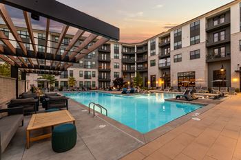 Resort-style saltwater swimming pool with tanning ledges and sundeck